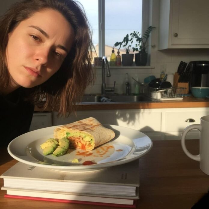 Sleepy selfie, kitchen dawn, plate of food.
