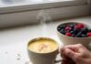 The Best Anti-Inflammatory Foods for Healthy Aging Turmeric latte & berries on rainy morning.